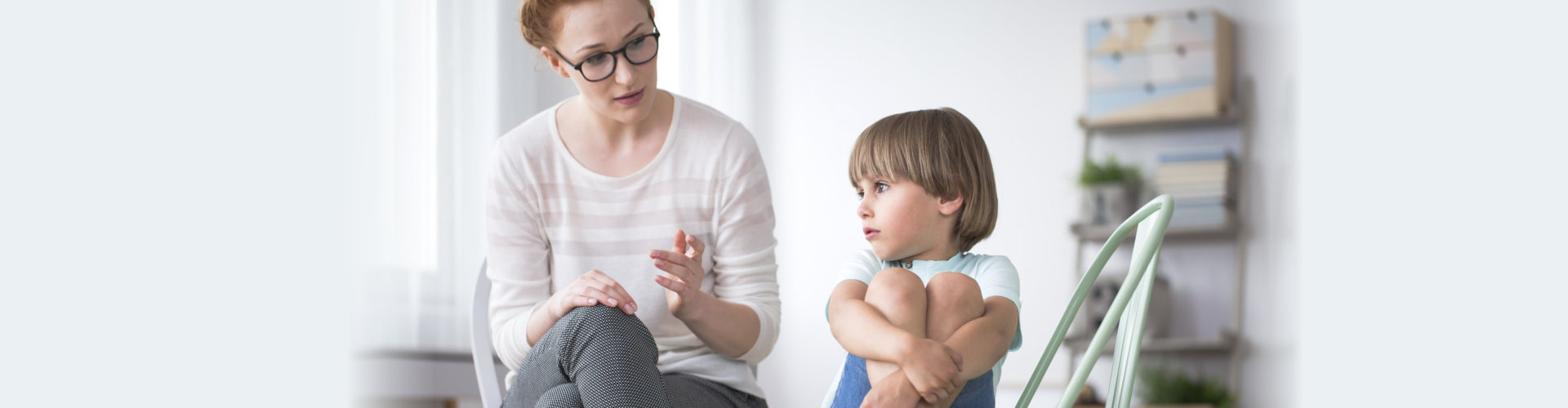 A kid with Asperger syndrome during therapy with a therapist