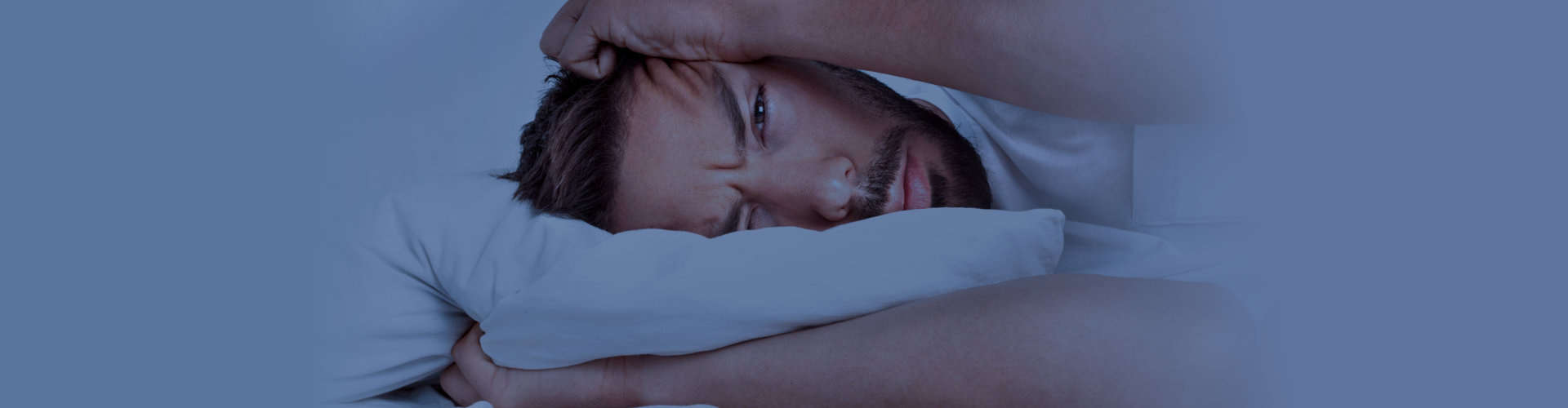 Man suffering from insomnia, sleeping problems or sleep disorders.