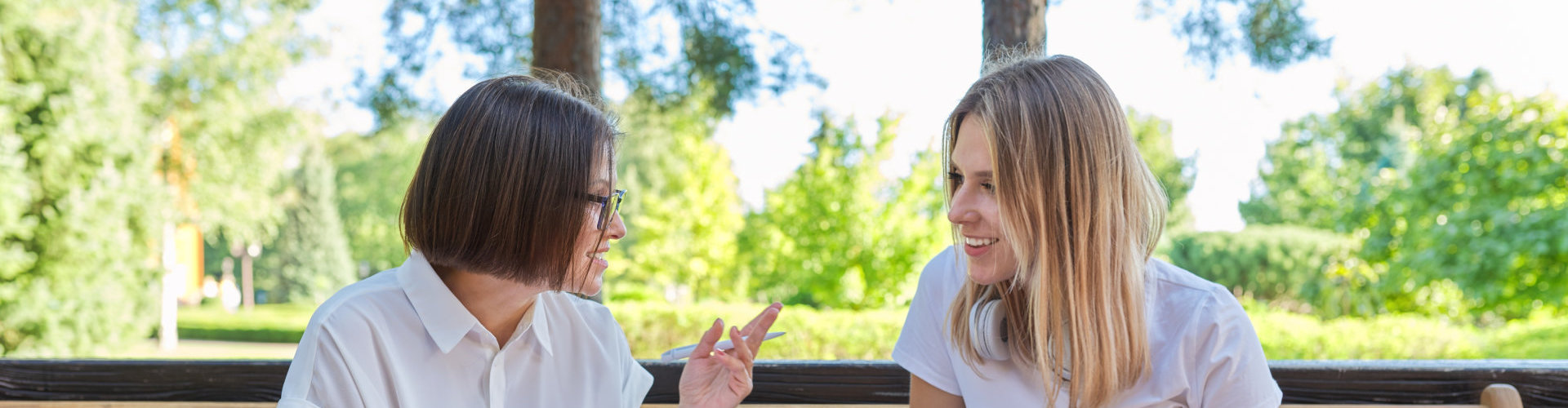 Woman talking to girl teenager