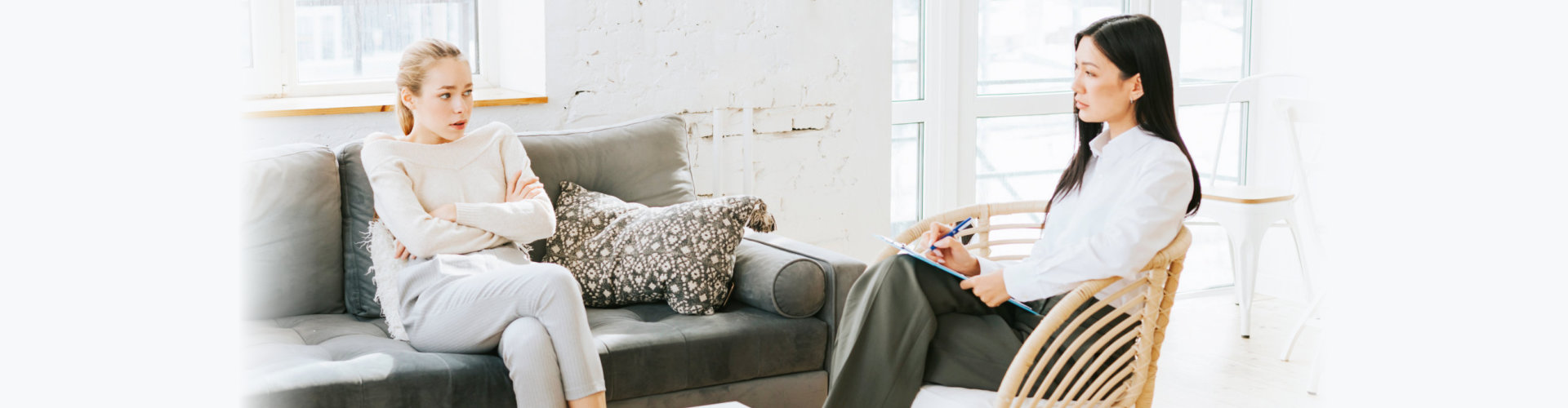 psychologist having a session with a young woman patient